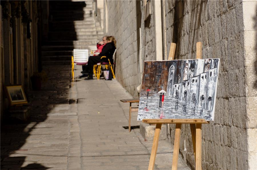 Red and black couple among historic buildings