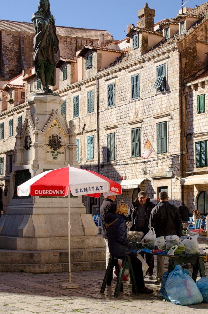 People enjoying sun in the square