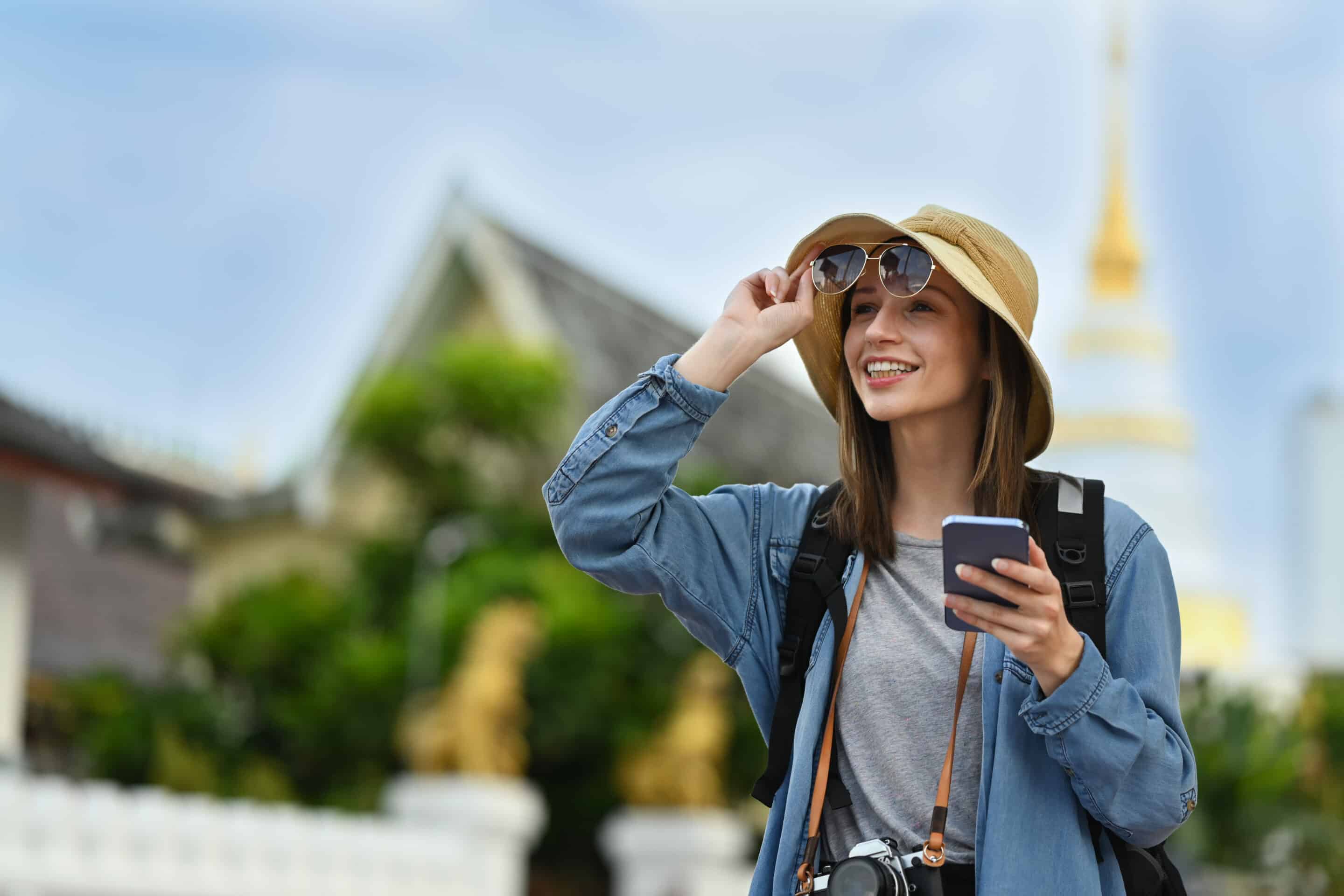 Visitor with a smartphone exploring a heritage site using a mobile guide